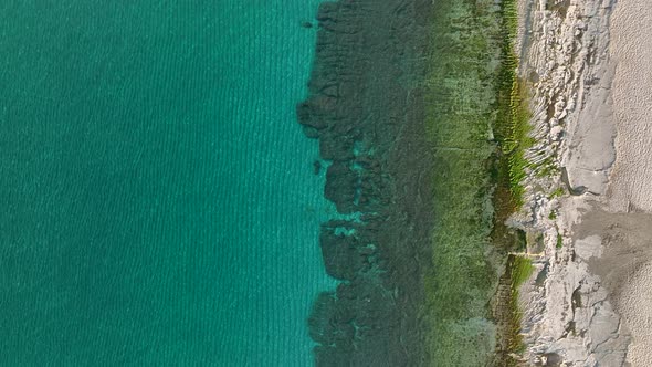 Texture of the rocky beach aerial view 4 K Turkey Alanya