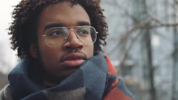 Young Afro-American Man Standing Outdoors on Winter Day