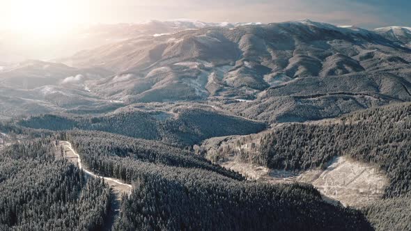 Sun at Snow Mountain Ridges Aerial