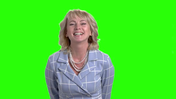 Elegant Woman Is Laughing on Green Screen.