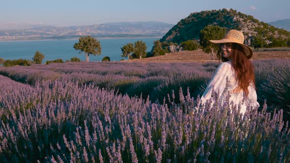Girl Walks Near Purple Lavender Field