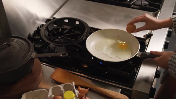 Caucasian woman cooking in her house