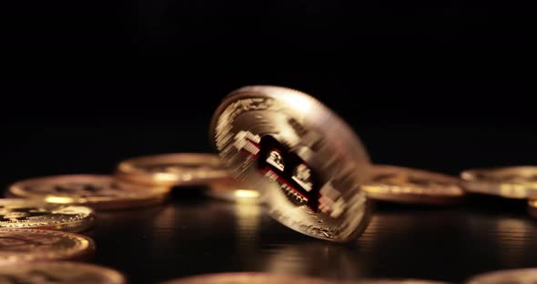 Gold Bit Coin BTC Cryptocurrency Coins on a Black Background