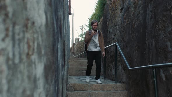 Attractive Young Caucasian Tourist Student Man Having Fun Happy and Excited Taking Voice Recognition