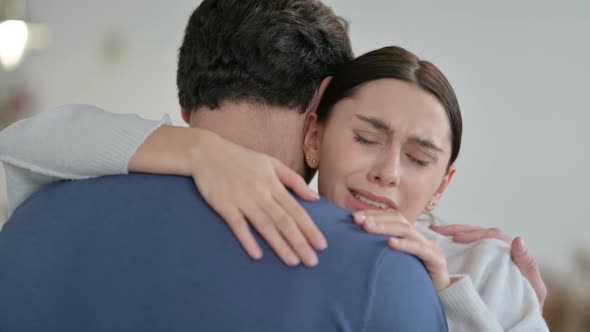 Crying Woman Hugging Man