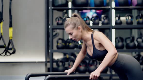 Sporty Woman Doing Exercise in Modern Gym