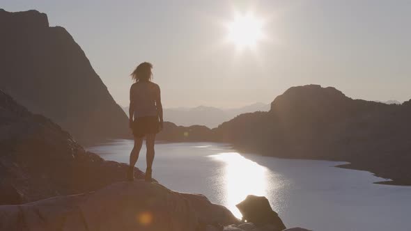 Adventurous Caucasian Adult Woman Hiking on Top of a Canadian Rocky Mountain