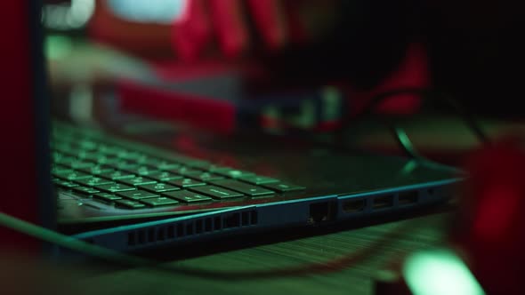 Professional Hacker Typing on Keyboard at Night Closeup of Man Hands Trying to Break Password Using