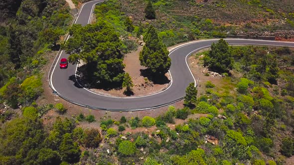 Top View of a Car Rides Along a Mountain Road on Tenerife Canary Islands Spain