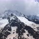 Flight above snowcapped mountains near Elbrus - VideoHive Item for Sale