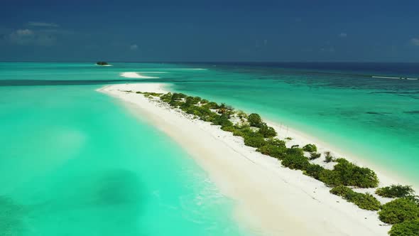 Aerial top view nature of idyllic lagoon beach adventure by blue water with bright sand background o