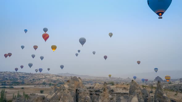 Timelapse of Flying Air Balloons Over Cappadocia Landscape at Sunrise