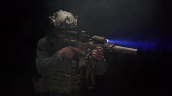 US Special Forces Soldier Aiming with Rifle at Night in Darkness