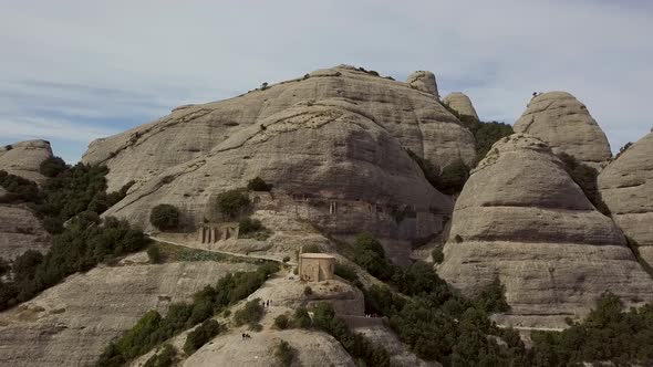 Aerial Shot Of Montserrat Mountain Range With Tourism Trail To A Chapel