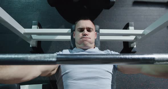 Young Man Working Out in Gym