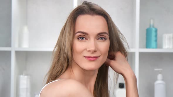 Fashion Smiling Woman Posing at White Cosmetology Clinic