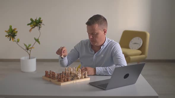 a Man in the Office Plays Chess