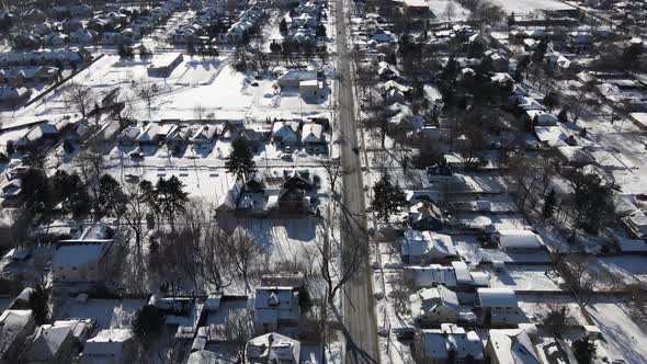 Aerial of suburban neighborhood sunny winter day