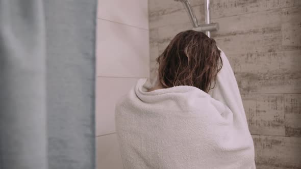 Woman Puts on White Towel After Shower in Bathroom