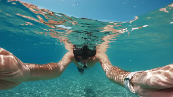 Man Snorkeling and Free Diving Underwater
