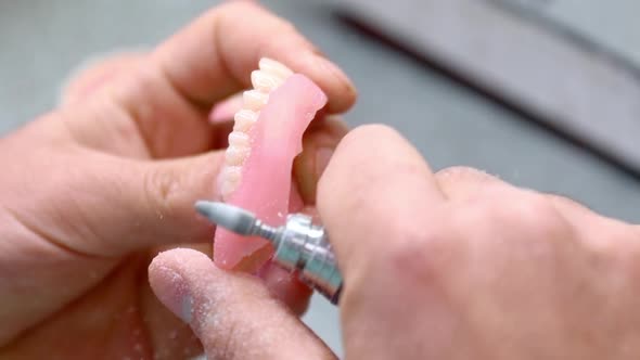 Dental Technician Works in Workshop and Makes Teeth for Dentistry