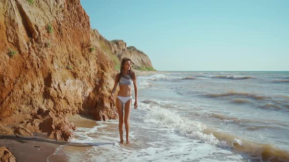 Slow Motion of Happy Joyful Slim Fitbody Woman Wearing in Bikini and Enjoying Wind and Waves on Sea