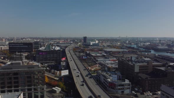 Fly Above Elevated Multilane Expressway Leading Through Industrial Borough