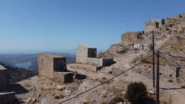 Mills in Motion on Mountain Peak By Mediterranean Sea Crete Greece