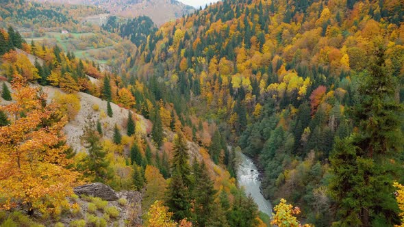 Mountain river in the autumn mountains. A turbulent current. Georgia, Svaneti.