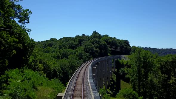 Aerial of Drone Flying Over Train Track Bridge 