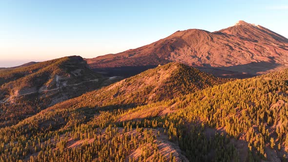 Aerial Panoramic Dramatic View of a Wilderness Mountain Peak and a Road Forest Rocky Volcanic