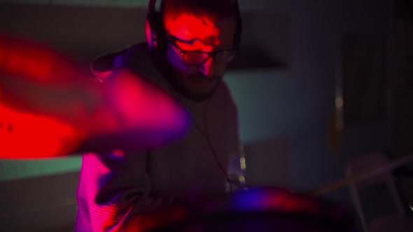 Drummer Playing Drums in the Nightclub