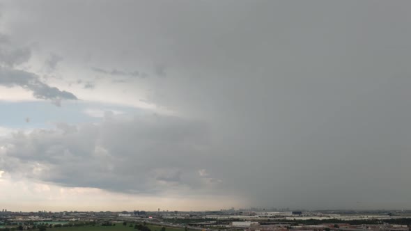 Time Lapse of a fast moving storm passing Airport of Toronto with a inbound plane before the storm h
