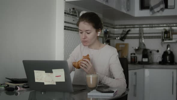 Woman Eat Her Breakfast During Remotely Work At Home