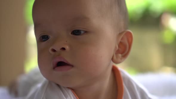 Happy portrait baby boy playing alone