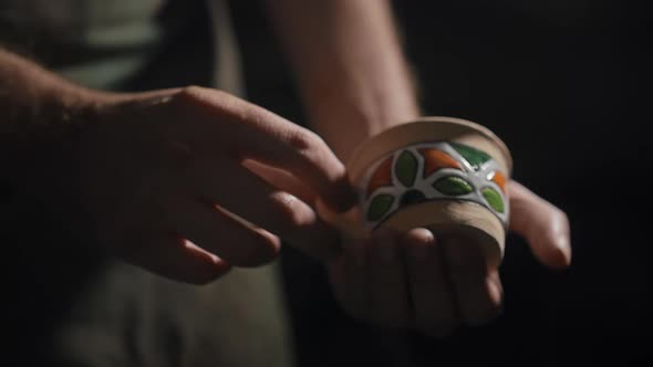 Ceramic Cup in Potter's Hands