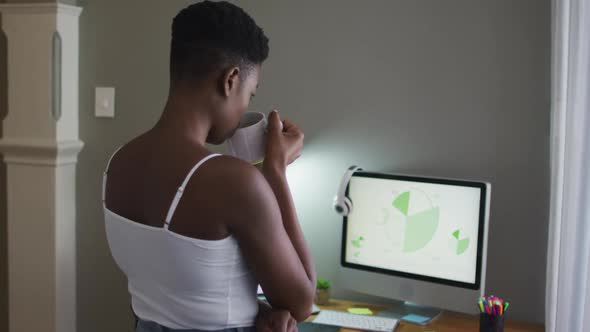 African american woman drinking coffee at home