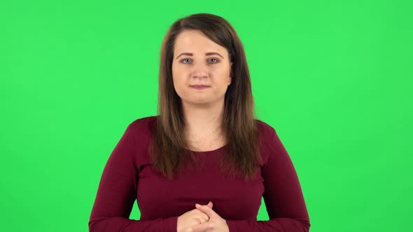 Portrait of Pretty Girl Looking at Camera with Anticipation, Then Very Upset. Green Screen