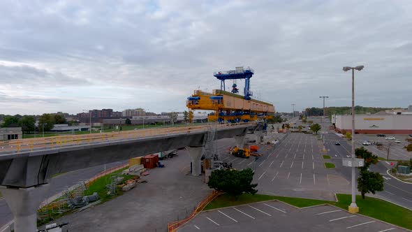 4K camera drone view of the construction site of the REM in Pointe Claire, Montreal.