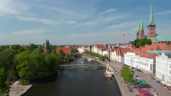 Forwards Fly Above Trave River Flowing Around Medieval Historic City Centre