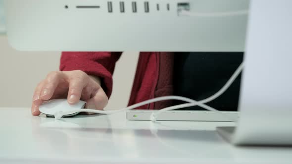 Woman Works on Big White Personal Computer