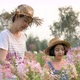 Slow motion Happy Asian mother and daughter planting flower together in the garden. - VideoHive Item for Sale