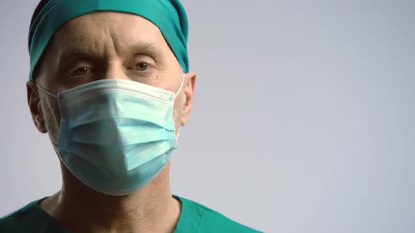 Serious Face of Surgeon in Medical Face Mask Looking to Camera, Health Insurance
