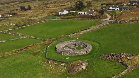 Loher Ringfort, Kerry, Ireland, March 2022. Drone orbits the ancient monument from the south while a