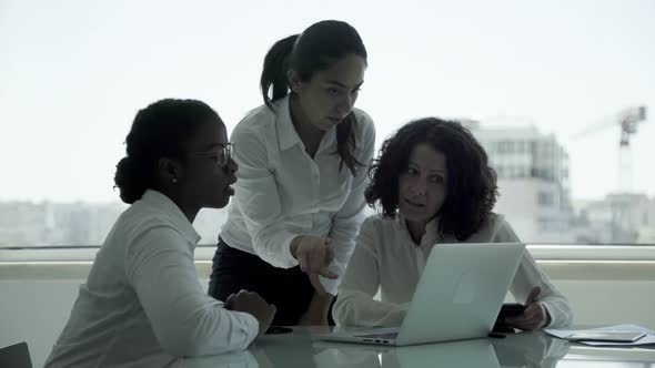 Focused Businesswomen Working with Laptop
