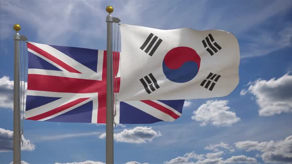 United Kingdom Flag Vs South Korea Flag On Flagpole