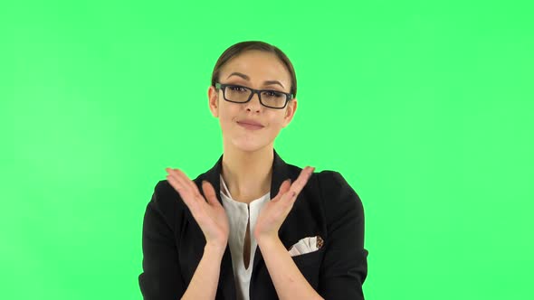 Girl Claps Her Hands Indifferently. Green Screen