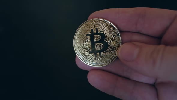 Bitcoin Coin in the Man's Hand