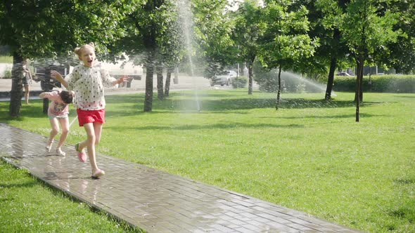 Girls Playing With The Dog At The Park 12