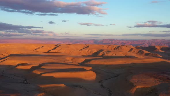 Aerial view of magical Israel desert Negev view. Panoramic landscape of the horizon with shadow terr